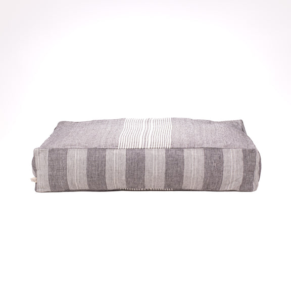 gray stripped floor cushion dog bed