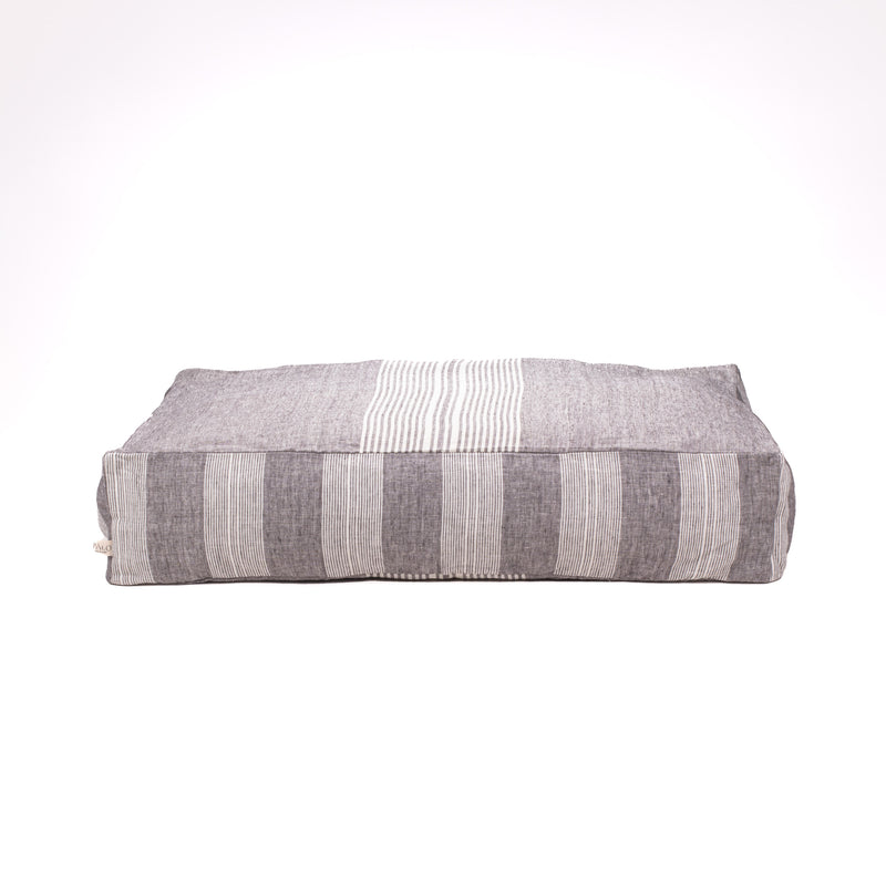 gray stripped floor cushion dog bed